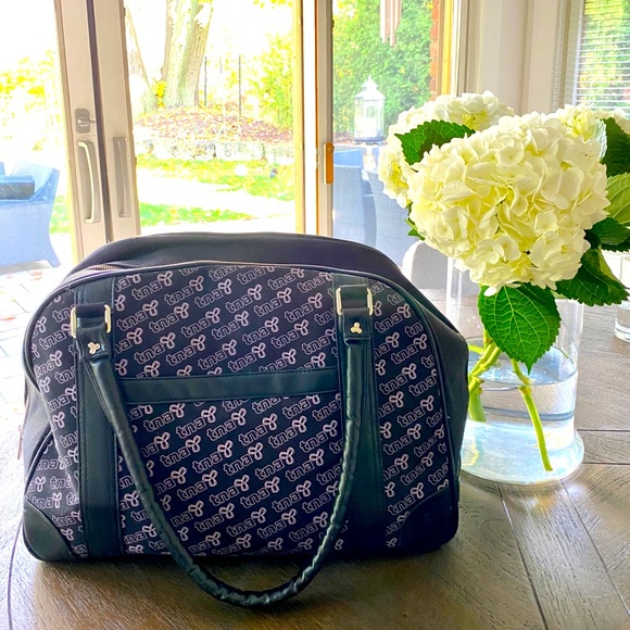 Large TNA duffel bag with purple writing